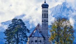 church and alps and sky