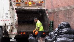 garbage truck and man loading